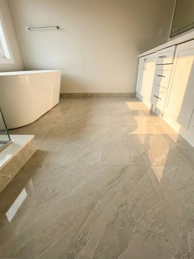 bathroom renovation Toronto - freestanding tub and large-format porcelain floor tile