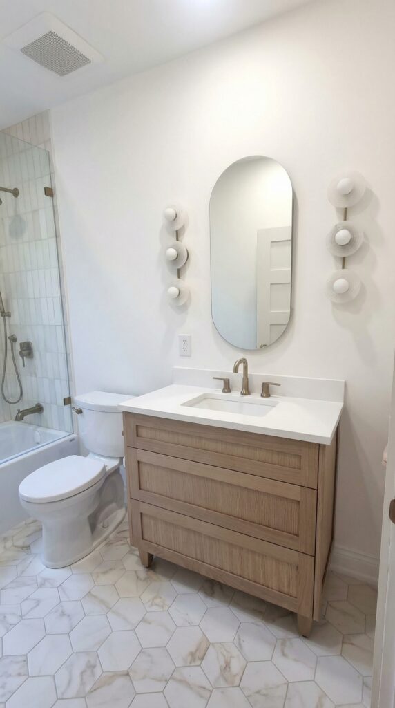 East York powder area with oak vanity and globe sconces